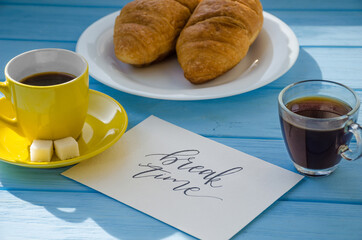 still life of cake with cup of coffee highlighted by sunlight