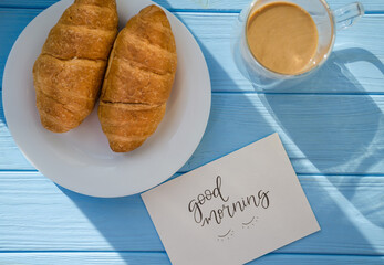 still life of cake with cup of coffee highlighted by sunlight