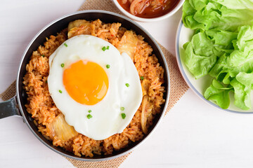 Korean food, Kimchi fried rice with fried egg in cooking pan, Top view