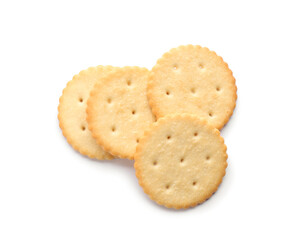 Delicious crispy crackers isolated on white, top view