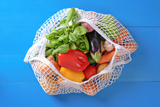 eco bag with vegetables on blue background, online food shopping, donates, online marketplace