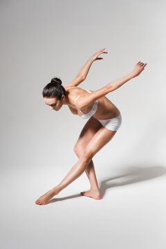 ballerina bending down to leg