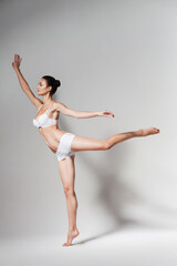 Fototapeta premium ballerina dancing in white room
