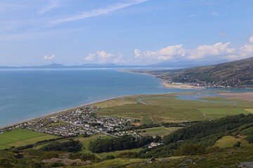 Fototapeta na wymiar A view from a high vantage point over Fairbourne, Barmouth and Cardigan Bay, Gwynedd, Wales, UK.