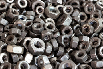 Obraz premium Rusty steel nuts of various sizes.
