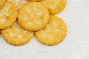 Pile of round cracker with sweet sugar isolated on white background