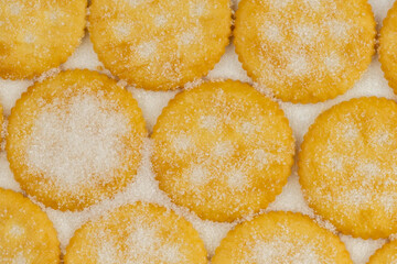 Spread of round cracker with sweet sugar isolated on white background