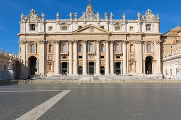 Facade of Saint Peter's Basilica at St.Peter's square. Few tourists wearing face masks due to the Covid-19 coronovirus pandemic, Vatican, Rome, Italy