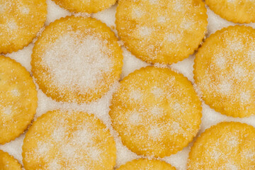 Spread of round cracker with sweet sugar isolated on white background