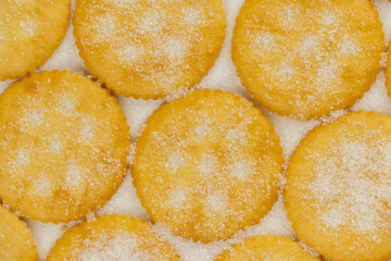 Spread of round cracker with sweet sugar isolated on white background