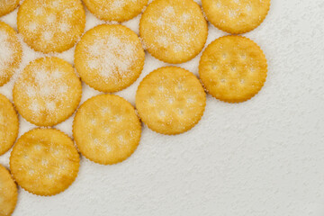 Spread of round cracker with sweet sugar isolated on white background