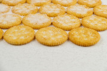 Spread of round cracker with sweet sugar isolated on white background