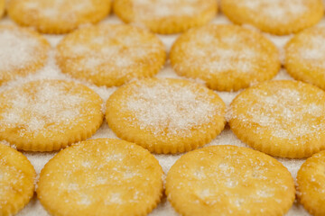 Spread of round cracker with sweet sugar isolated on white background