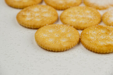 Spread of round cracker with sweet sugar isolated on white background