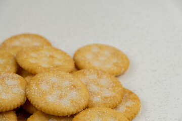 Pile of round cracker with sweet sugar isolated on white background