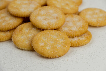Pile of round cracker with sweet sugar isolated on white background