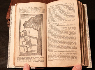 Bunyan's famous allegorical work 'Pilgrim's Progress' first printed in 1678. This edition printed around 100 years later with primitive woodcuts. 