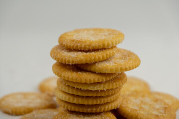 Pile of round cracker with sweet sugar isolated on white background