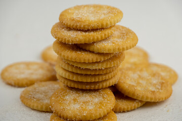 Pile of round cracker with sweet sugar isolated on white background