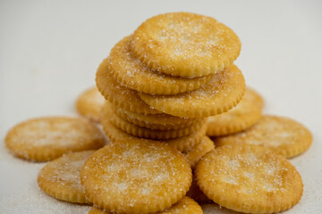 Pile of round cracker with sweet sugar isolated on white background