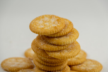 Pile of round cracker with sweet sugar isolated on white background