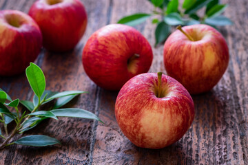 Red apples on wooden table