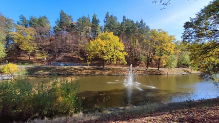 fountain in the autumn lake