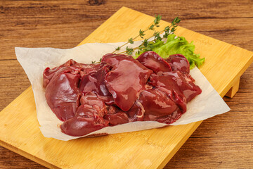 Raw chicken liver over board