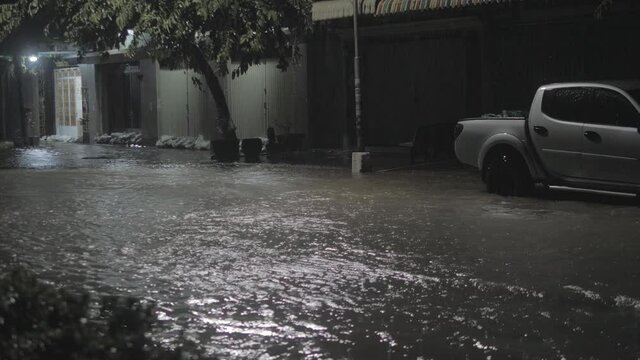 flooded street during rains at night