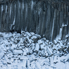 Columnar Basalt Columns by Aldeyjarfoss waterfall in winter. North Iceland.