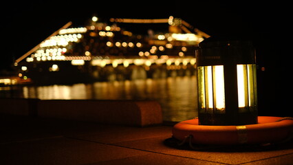 street lamp at night and the background is cruiseship