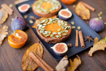 Pumpkin pies on a black plate