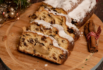 Sliced Christmas Stollen. Traditional German Christmas cake with dried fruit