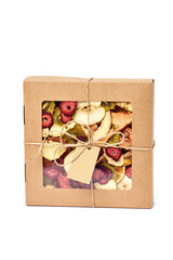 Dried fruits in craft paper box with transparent lid