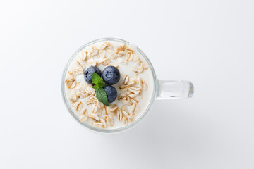 Yogurt dessert with oatmeal, blueberries, raspberry and mint