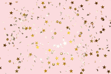 gold shiny flying confetti on a pink background festive backdrop