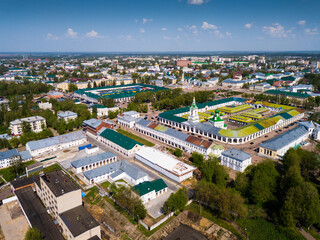 Fototapeta premium Scenic view from drone of Kostroma cityscape on bank of Volga River with complex of provincial trading arcades (Gostiny Dvor), Russia