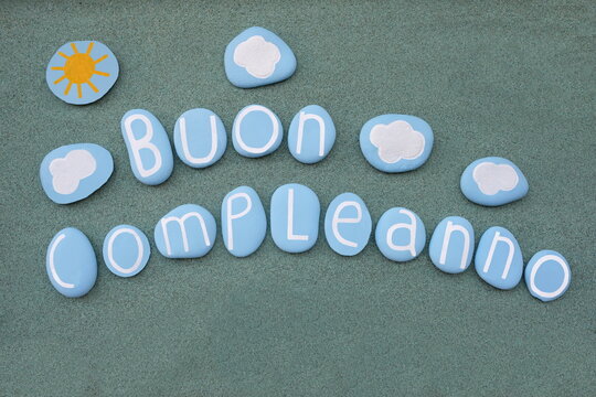 Buon Compleanno, italian Happy Birthday text composed with blue colored stone letters
