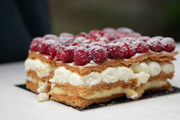 Fresh raspberries cake with powdered sugar.