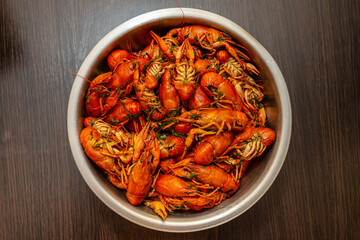 Large bowl of fresh boiled crawfish with dill from above