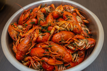 Large bowl of fresh boiled crawfish with dill from above