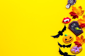 Halloween background concept - gingerbread cookies and candies, top view