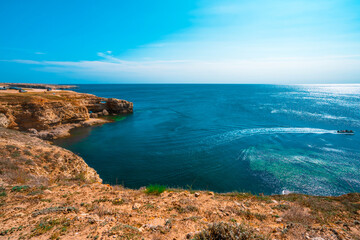 Black sea coastline with cliffs, rocks, turquoise waves and sea foam. Breathtaking, scenery landscape in Crimea