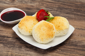 Curd pancakes with jam and stravberry