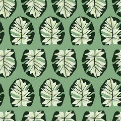 Exotic seamless hawaii pattern with simple monstera shapes ornament. Pastel foliage print in green tones. Floral artwork.