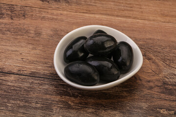 Pickled black olives in the bowl