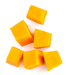 Diced Pumpkin  isolated on white background.  Fresh Pumpkin pieces cut in a cube slice, top view. Flat lay.