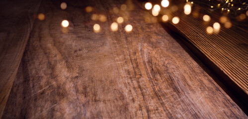 Christmas bokeh lights on aged wooden table
Fresh dough for for christmas cookies on rustic wood. Background for christmas bakery with fairy lights and space for your decoration.