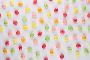 Small round candy-colored pastels on pastel background.