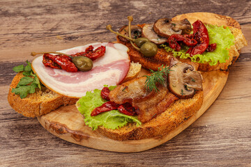 Italian appetizer - bruschetta mix with meat